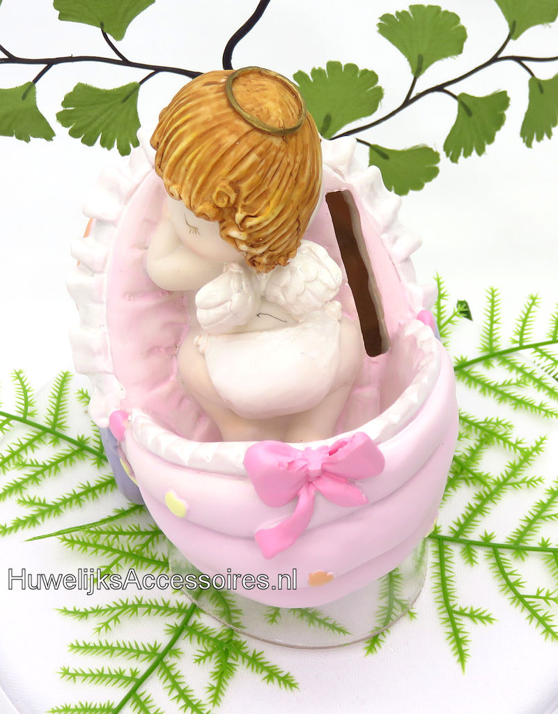 Slappende baby meisje in roze wieg spaarpot