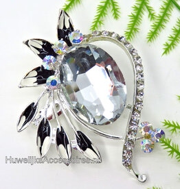 Broche met een grote grijze strass steen