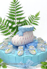 Geboorte taart bedankjes met blauwe speentjes en schoentjes