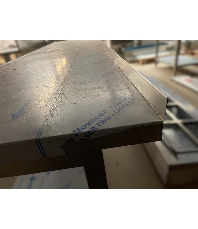 Occasion: RVS Werktafel met onderplank en spatrand | (B)284x(D)70x(H)84cm