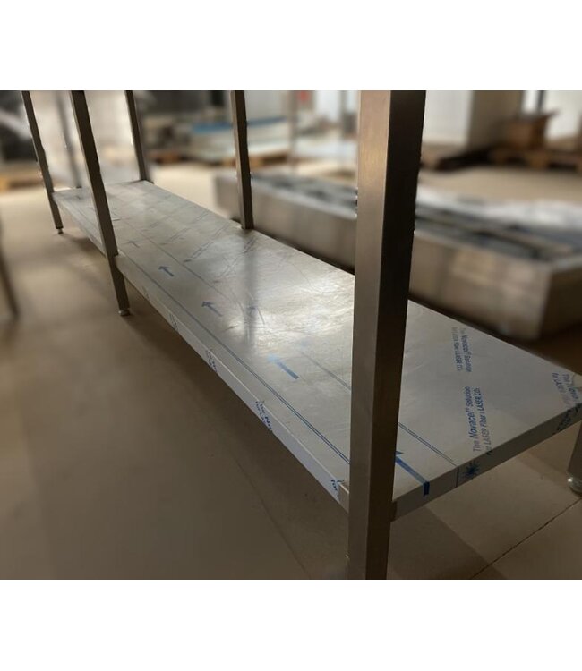 Occasion: RVS Werktafel met onderplank en spatrand | (B)284x(D)70x(H)84cm