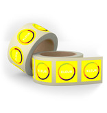 Fluorescent yellow paper stickers on a roll
