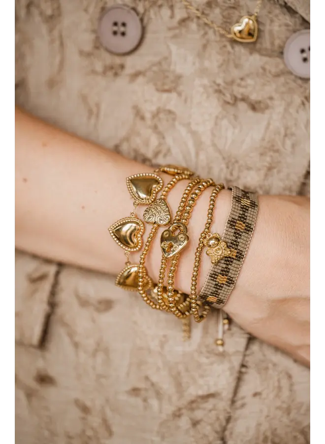 By shir gouden elastische armband met een hart slotje-goud