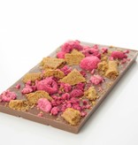 A bar of milk chocolate with speculoos and raspberry