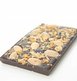 A bar of dark chocolate with almonds, caramel and seasalt