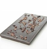 A dark chocolate bar with cocoa nibs