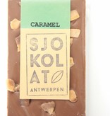 A bar of milk chocolate with pieces of caramel