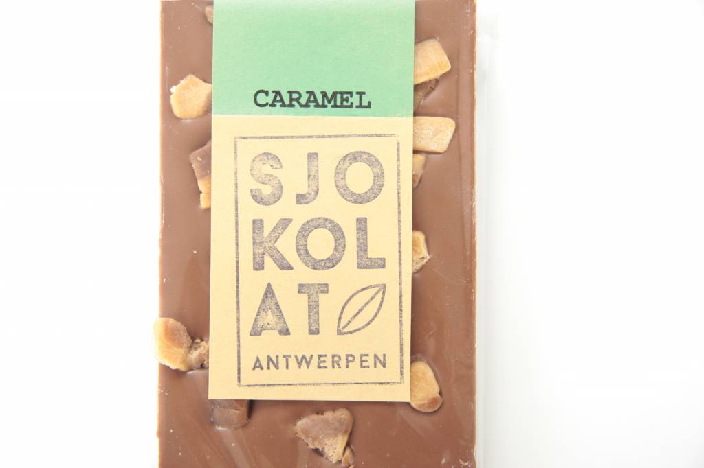 A bar of milk chocolate with pieces of caramel