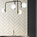 Tampere special black and gold ceiling lamp with curved arms and 4x E14 in a white sphere