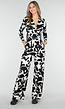 Zwart-Witte Stretch Jumpsuit met Print en Overslagtop