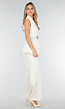 Witte Matchende Set met Mouwloze Top, Statement Riem en Wide Leg Broek