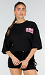 Zwart Oversized T-shirt met Roze Tekst en Korte Mouwen