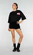 Zwart Oversized T-shirt met Roze Tekst en Korte Mouwen