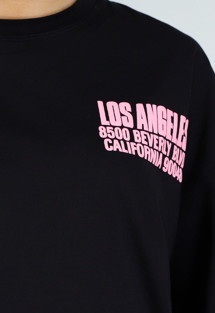 Zwart Oversized T-shirt met Roze Tekst en Korte Mouwen