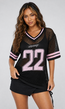 Zwart Gebreide Jersey met Roze Cijferprint en Korte Mouwen