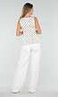 Witte Peplum Top met Zwarte Stippen en Ronde Hals