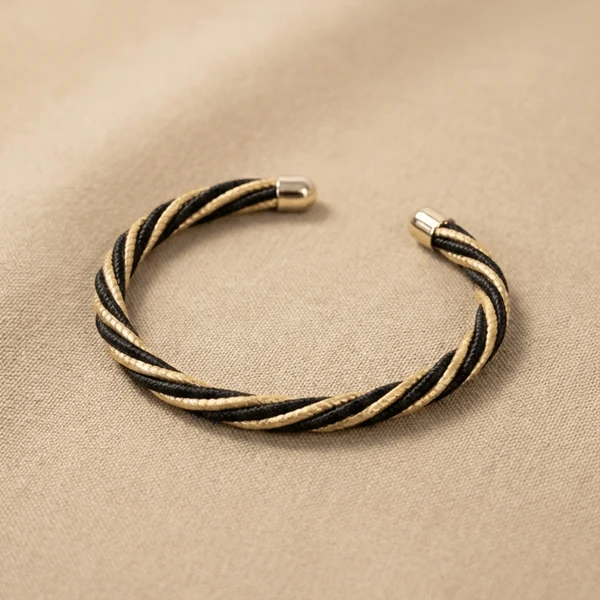 Armreif gedreht schwarz/gold