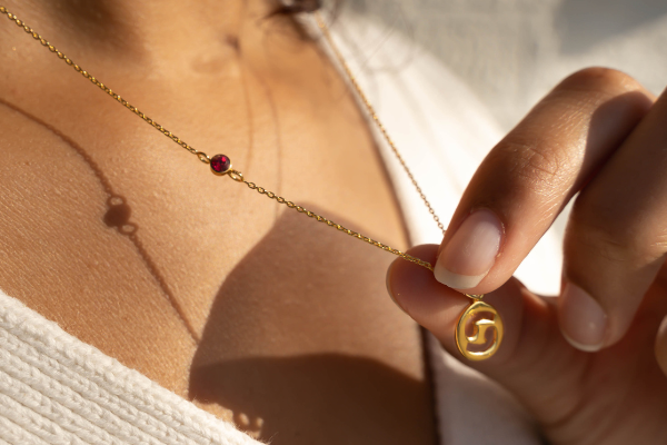 Gold necklace with zodiac sign