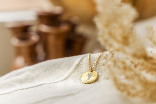 Necklace with footprint and name