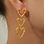 KAYA sieraden Statement drop earrings with open hearts | Stainless Steel Gold