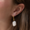 KAYA sieraden Statement hoop earrings with baroque pearls | Stainless Steel Gold