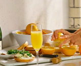 Wat drink je bij een Paasbrunch? Maak de perfecte mimosa met champagne