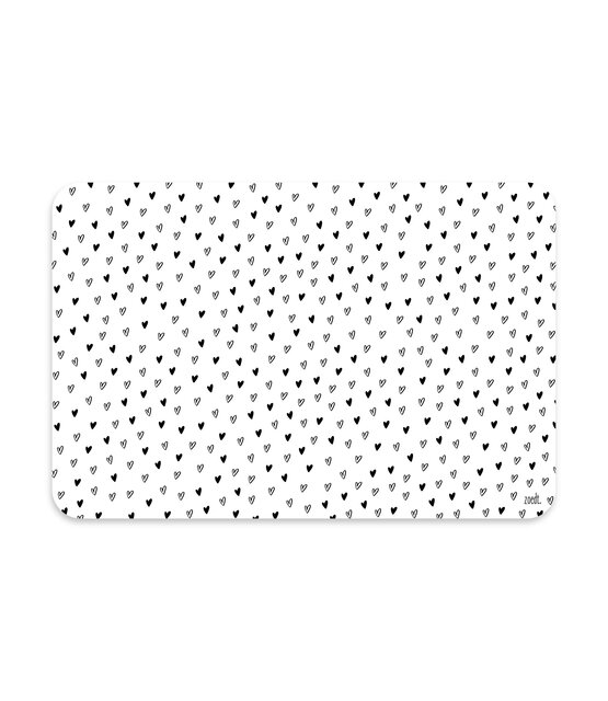Placemat van wit vinyl met zwart hartjes patroon – een stijlvolle en praktische toevoeging aan jouw eettafel