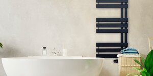 Hoe kan ik een designradiator op een creatieve manier in mijn interieur verwerken?