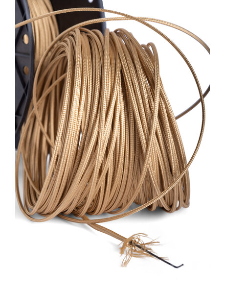 Very thin gold-colored electrical cord, fabric covered
