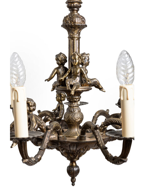 Old chandelier, burnished, with angels