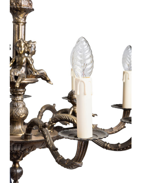Old chandelier, burnished, with angels