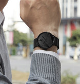 DIJANES Minimalistyczny zegarek dla mężczyzn - Moda Ultra-cienki biznesowy mechanizm kwarcowy Czarny skórzany pasek