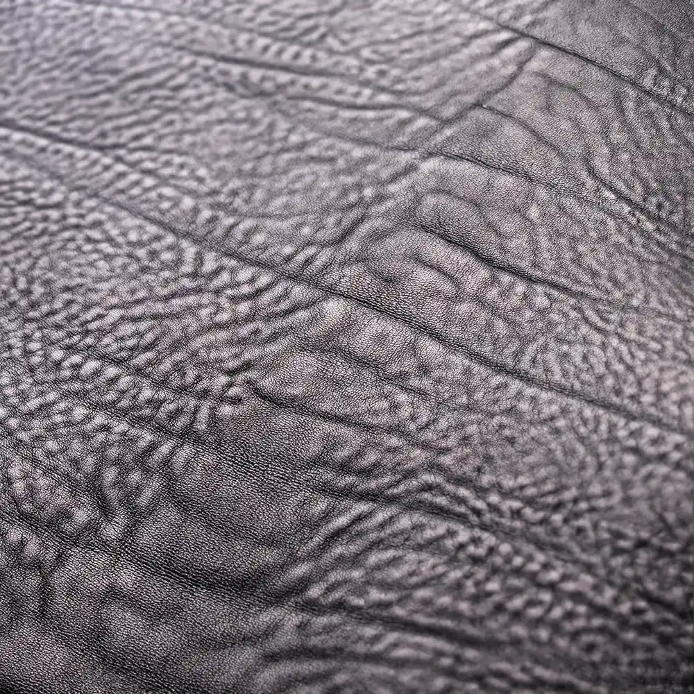 Coarse back fold on cowhide leather