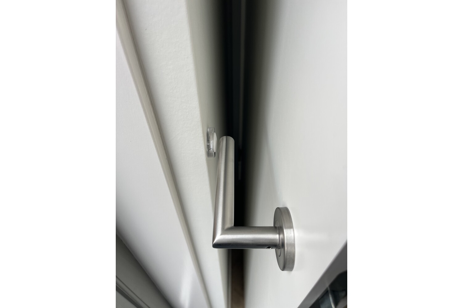 Deurstopper voor muurbevestiging (transparant/wit) Deurstopper voor muurbevestiging (transparant/wit)
