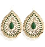 Ovale gouden oorhangers met groene dots