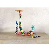Toms Drag Kleurrijke akrobaat, liggend met waxinelichtschotel