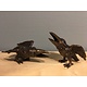 Two bronze crows