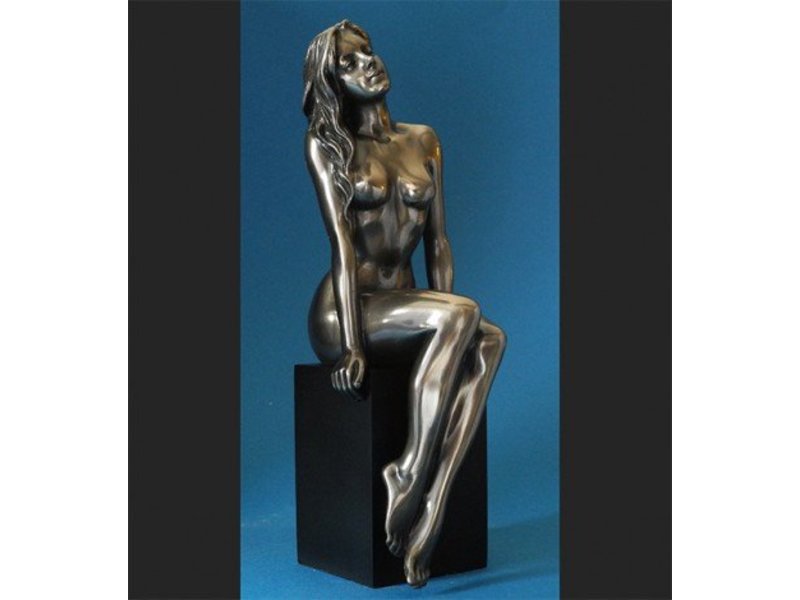 BodyTalk Nude woman sitting on black pedestal
