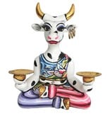 Toms Drag Cow Muni in yoga position, candle holder