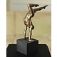 Nude sculpture of an exercising athleet in bronze look