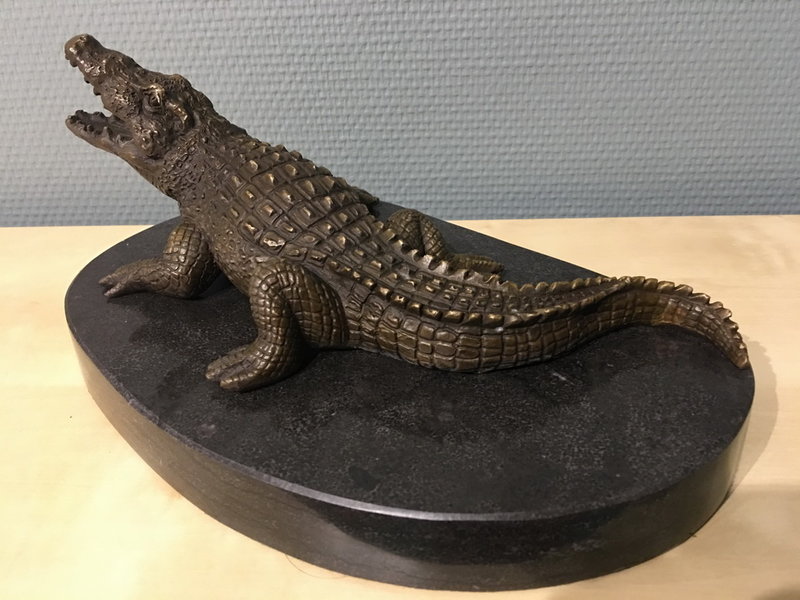 Bronze crocodile on oval natural stone base