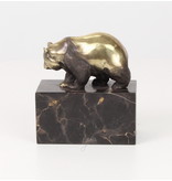 Walking panda bear made of bronze on a block of veined natural stone