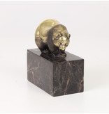 Walking panda bear made of bronze on a block of veined natural stone