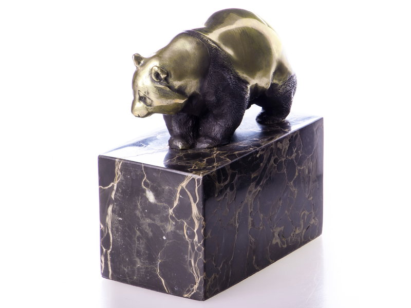 Walking panda bear made of bronze on a block of veined natural stone