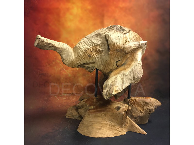 head of an elephant carved from wood