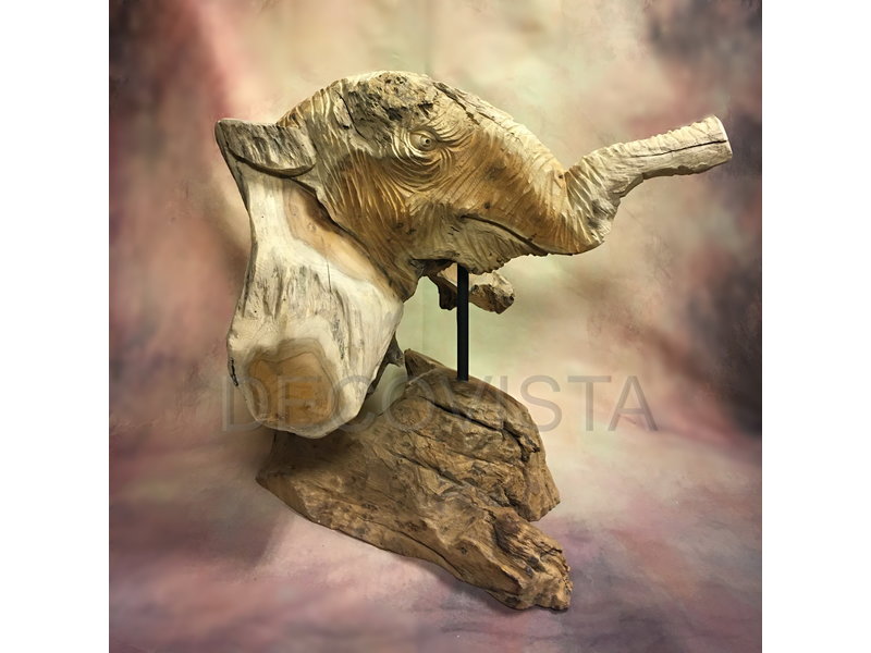 head of an elephant carved from wood