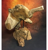 head of an elephant carved from wood