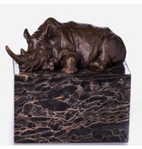 Rhinoceros statue in bronze on a natural stone base