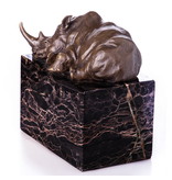 Rhinoceros statue in bronze on a natural stone base