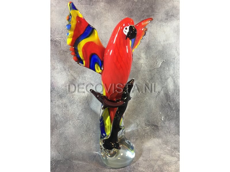 Colorful Scarlet Macaw parrot of glass